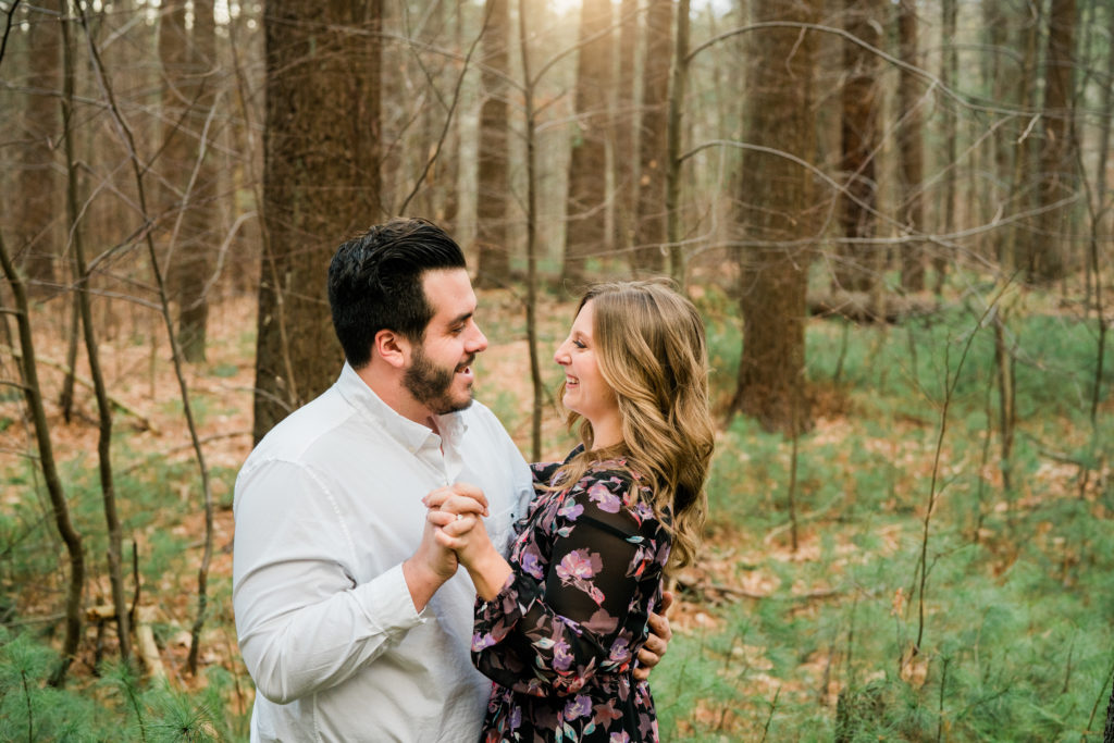 engaged couple in the greenery at Prosser Pines, Middle island, NY