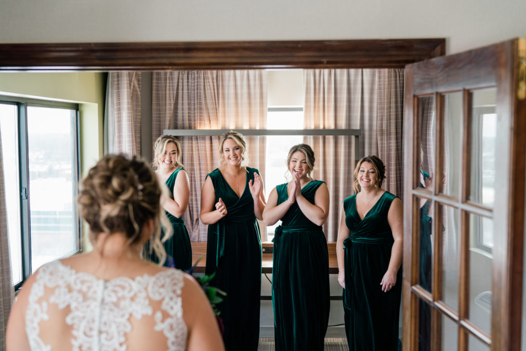 bridesmaid reaction to bride in her gown